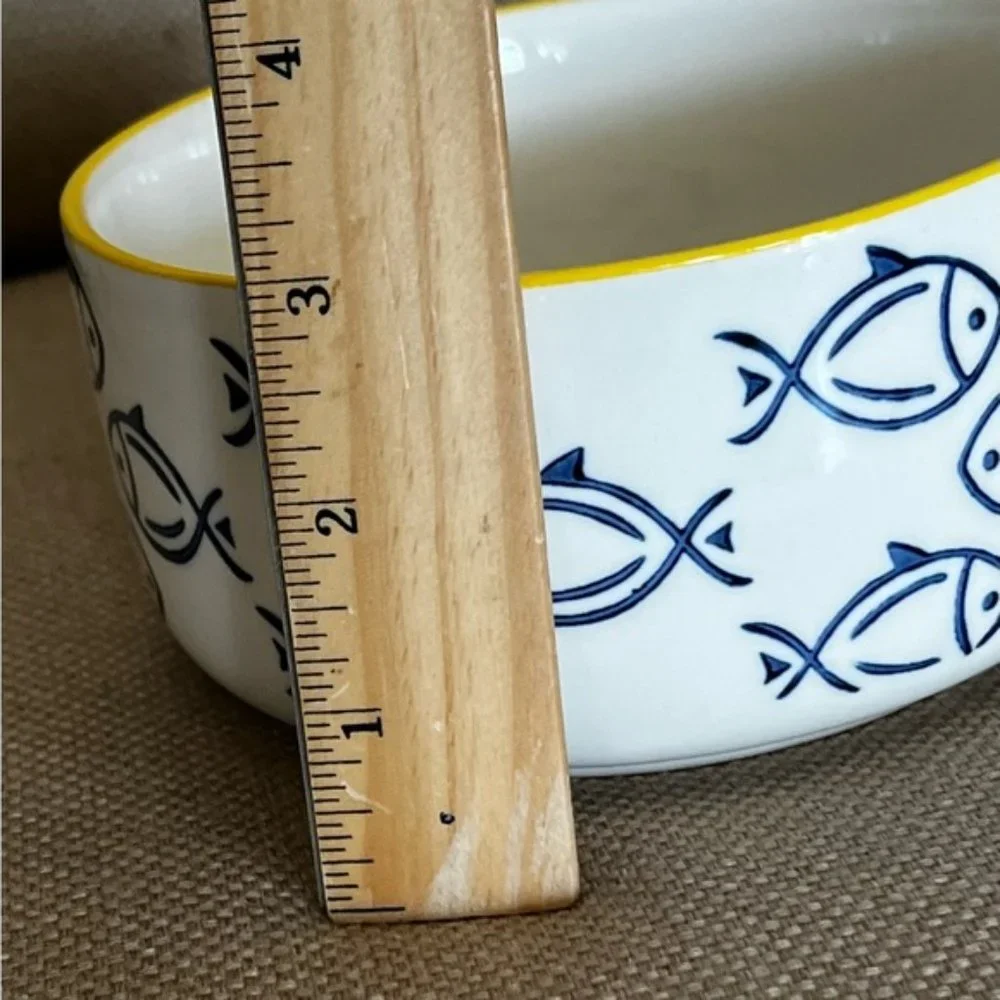 Large Ceramic white bowl with blue fish design. Like new, no scratches or chips.